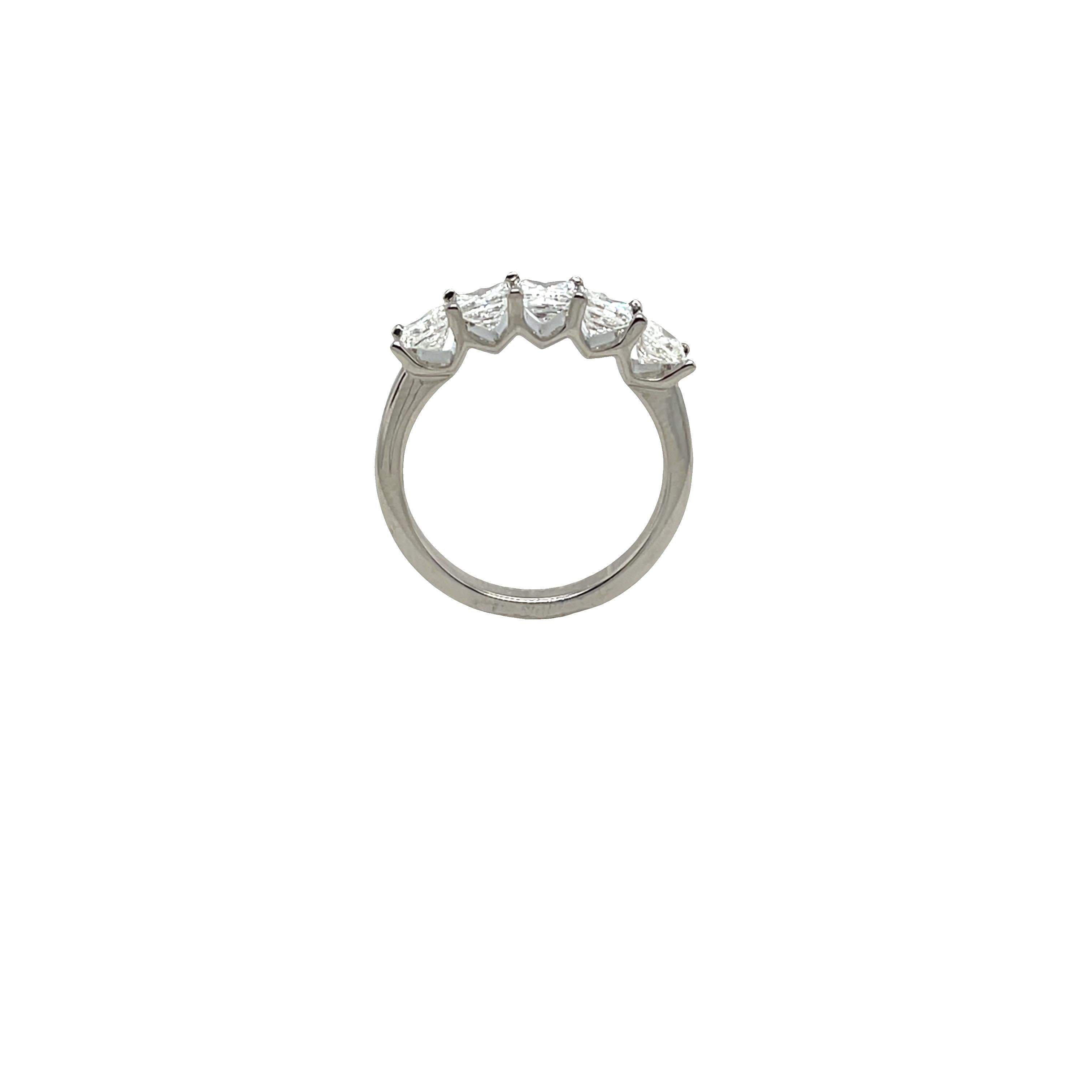 Elegant and timeless, this platinum ring features five stunning natural princess cut diamonds.
The diamonds are securely claw-set across the band, 
offering maximum brilliance and sparkle. 
Total Diamond Weight: 1.45ct
Diamond Colour: G/H
Diamond