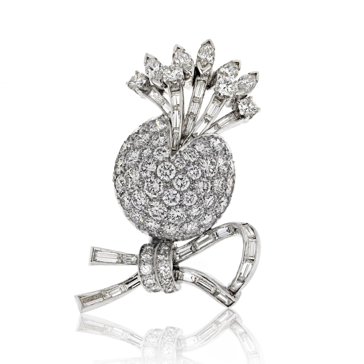 Perfect diamond brooch to decorate your blazer or your dress for the next event or special occasion. This brooch is made in platinum with 4.50cts in mixed cut diamonds and is all fire!
It is not too big just 1.25 inches wide whi]ch is perfect in