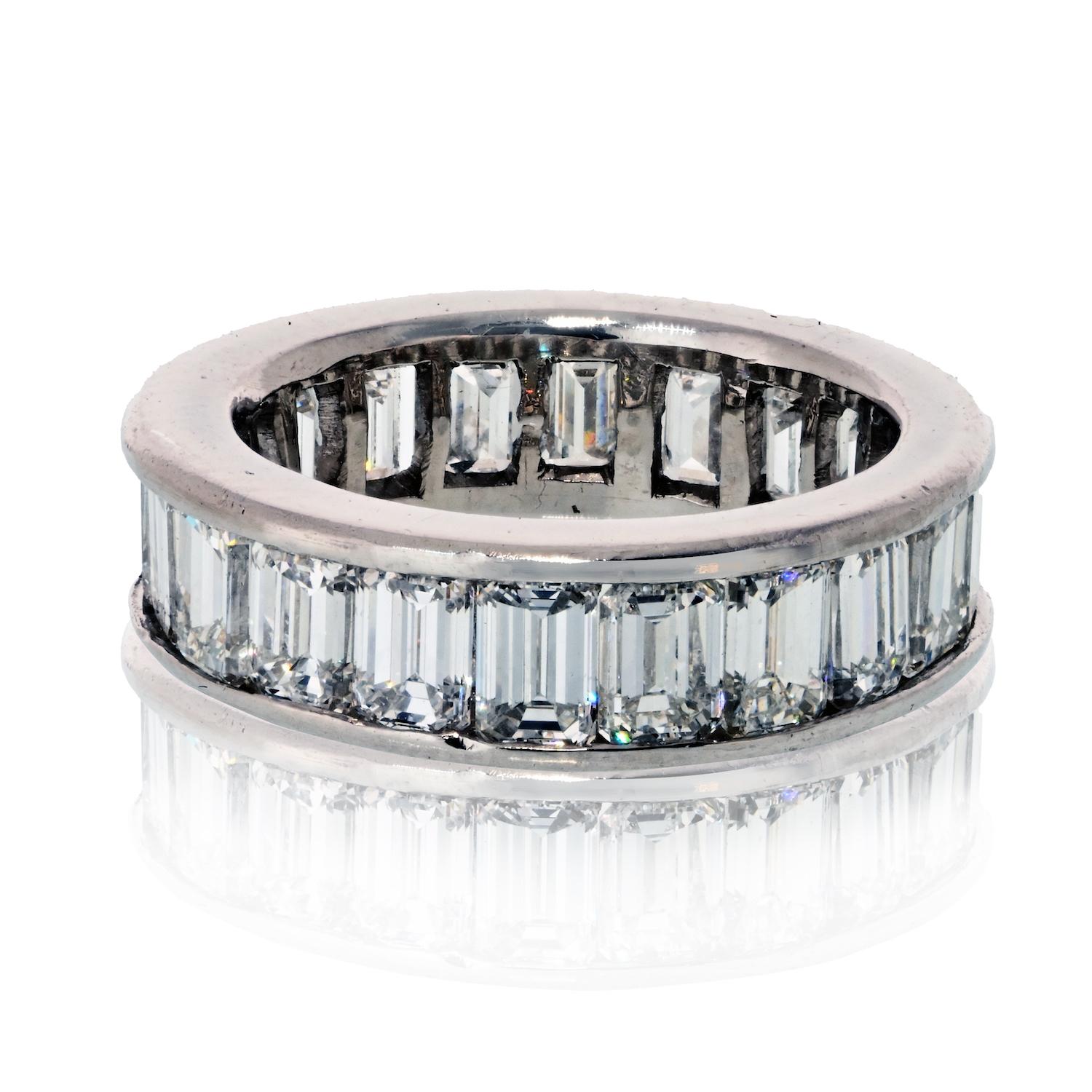  
A timeless and elegant design, this vintage eternity band features approximately 5.00 carats of emerald-cut diamonds, channel-set in rich platinum. The diamonds are graded F-G color and VS-SI clarity, offering beautiful brilliance and clean lines.