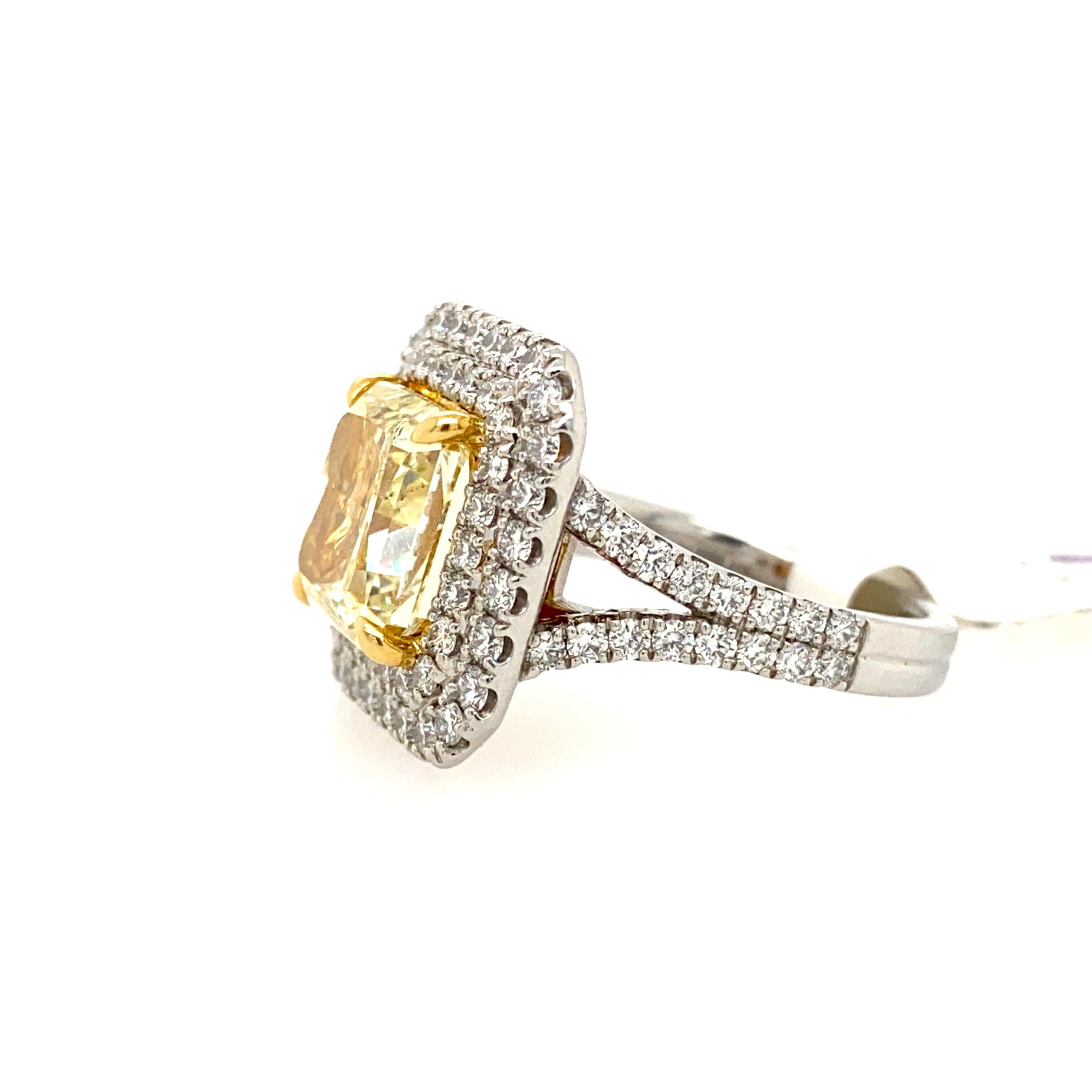 This beautiful radiant cut diamond is set in a double halo diamond ring made of platinum and 18k yellow gold.
Yellow gold diamonds this size are rare and valuable.
White diamonds weight is 0.80 carat total.