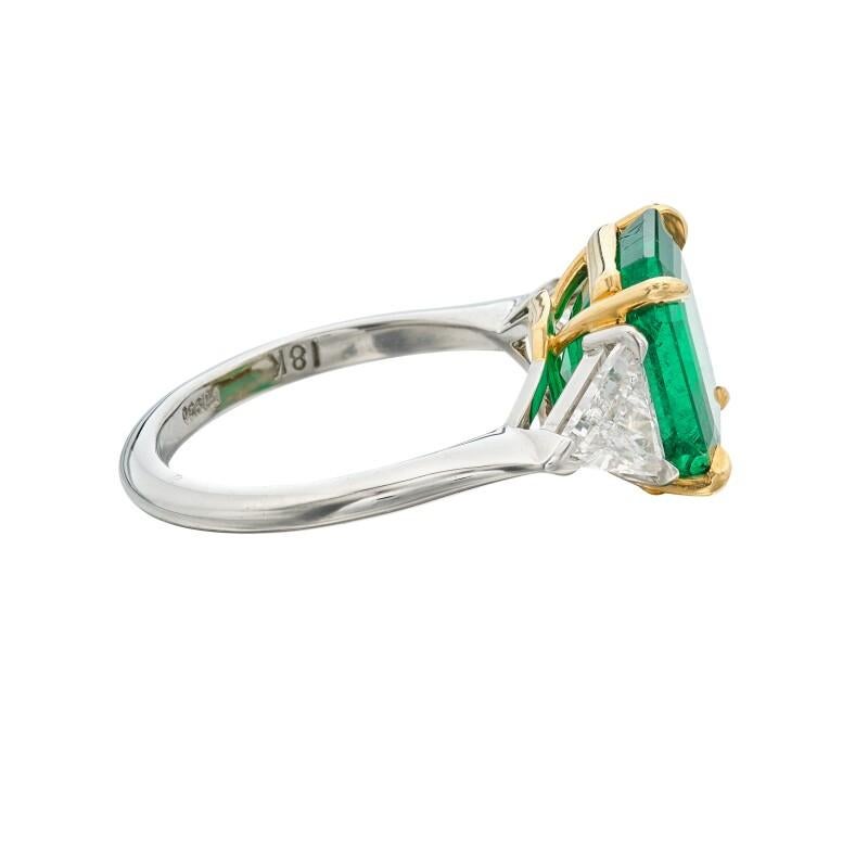 Platinum, 5.11ct Emerald Cut Colombian Emerald and Diamond Three Stone Ring In New Condition In New York, US