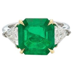 Platinum, 5.11ct Emerald Cut Colombian Emerald and Diamond Three Stone Ring