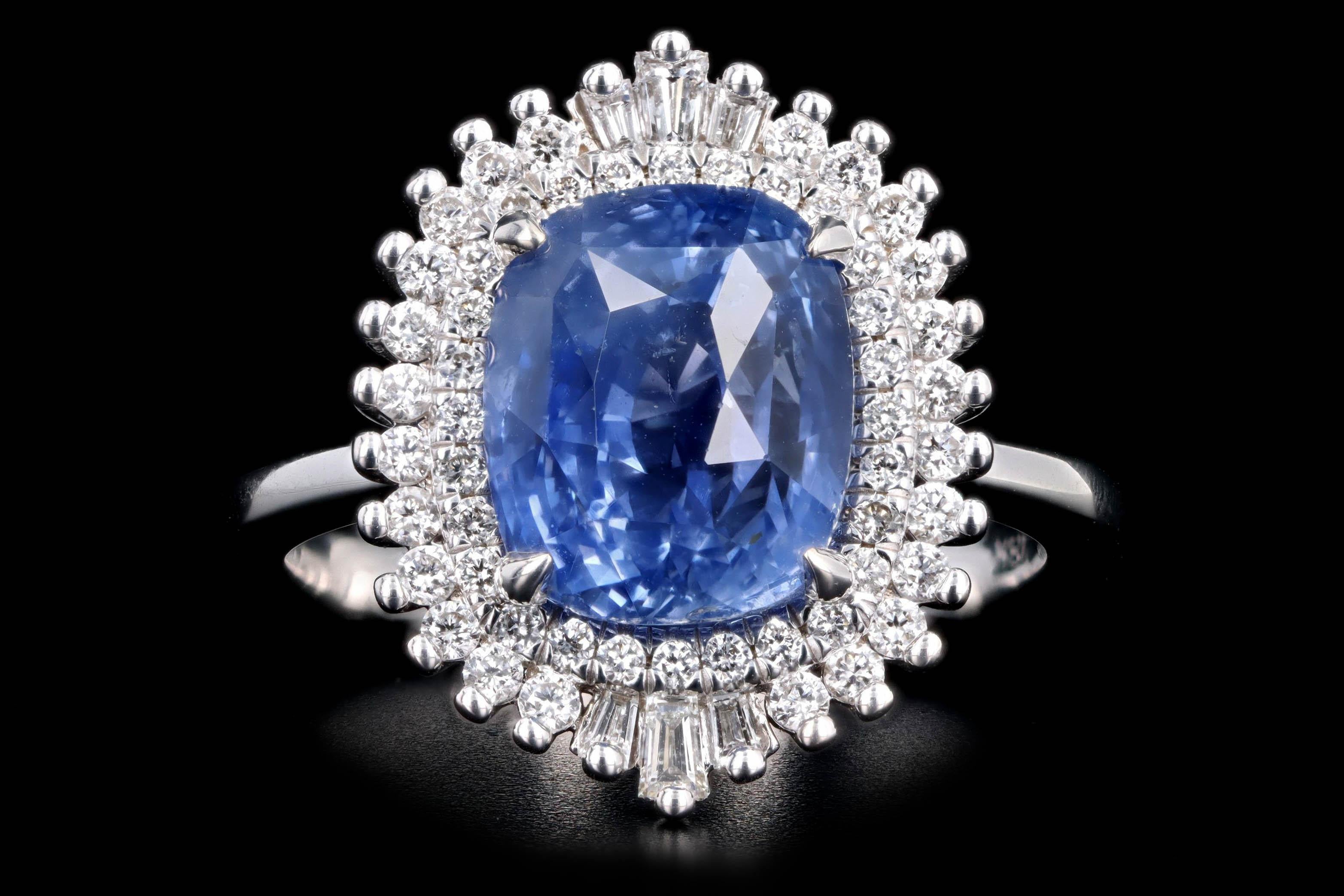 Era: New 

Composition: Platinum 

Primary Stone: Cushion Cut Natural Sapphire

Carat Weight: 5.12 Carats

Origin: Sri Lanka

Treatment: No Indications of Heating

GIA Report Number: 2213403130

Accent Stone: Round Brilliant Cut & Tapered Baguette