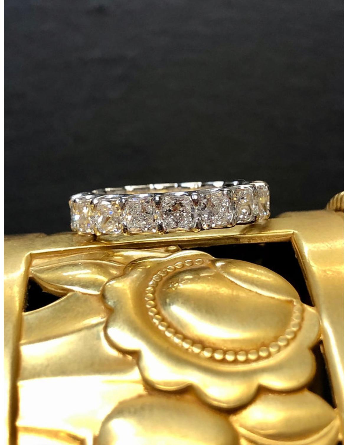 A classic eternity band done in platinum and set with 18 radiant cut diamonds being G-H color and Vs1-2 in clarity. Total approximate diamond weight is 5.40cttw.

Dimensions/Weight
4.5mm wide. Size 6 3/4. Weighs 3.6dwt.

Condition
All stones are