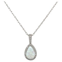 Platinum .54ct Australian Opal and Diamond Halo Pendant with 18" platinum chain