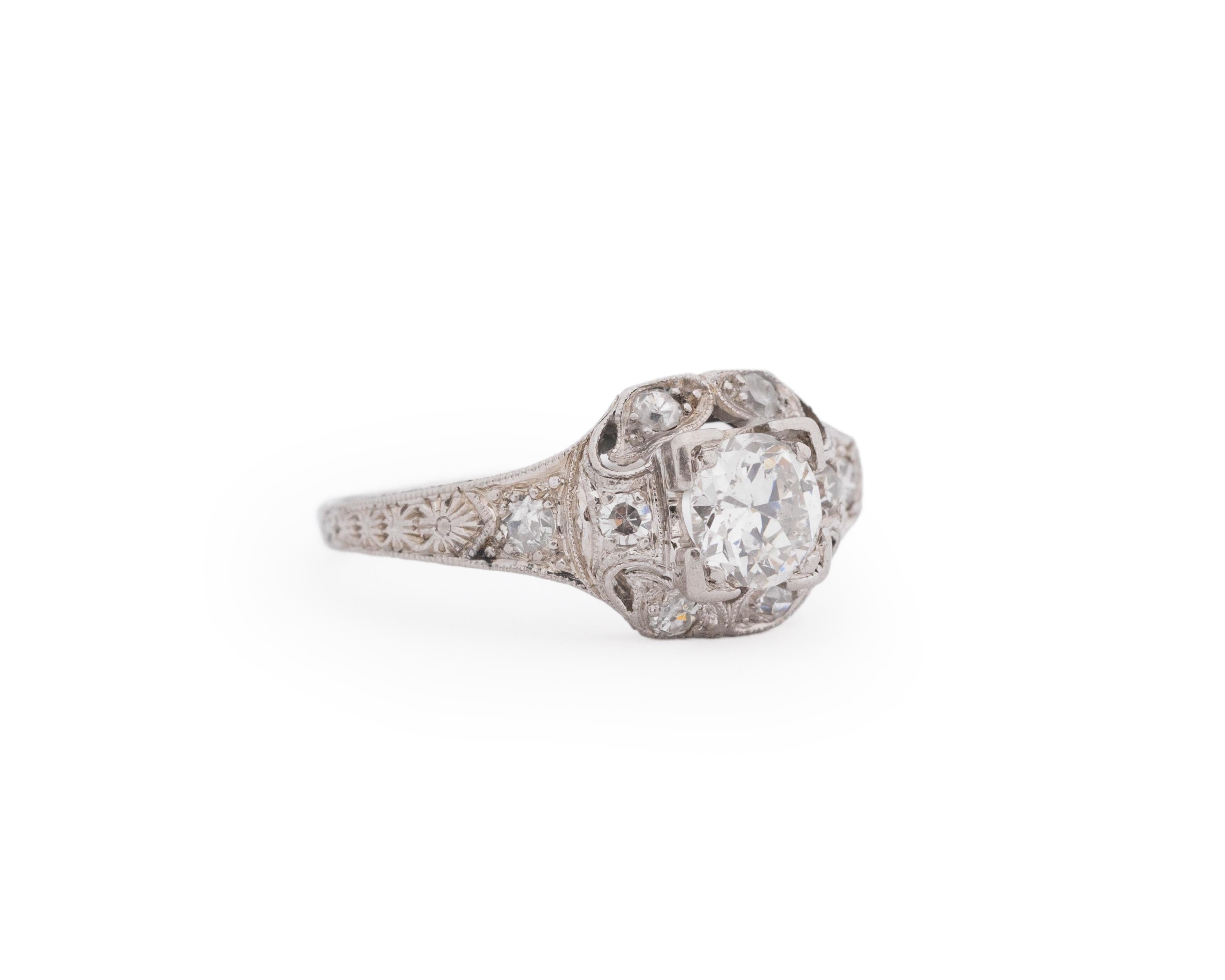 Year: 1920s

Item Details:
Ring Size: 5.75
Metal Type: Platinum [Hallmarked, and Tested]
Weight: 3.3. grams

Center Diamond Details:
Weight: .55ct total weight
Cut: Old European brilliant
Color: G
Clarity: VS
Type: Natural

Finger to Top of Stone