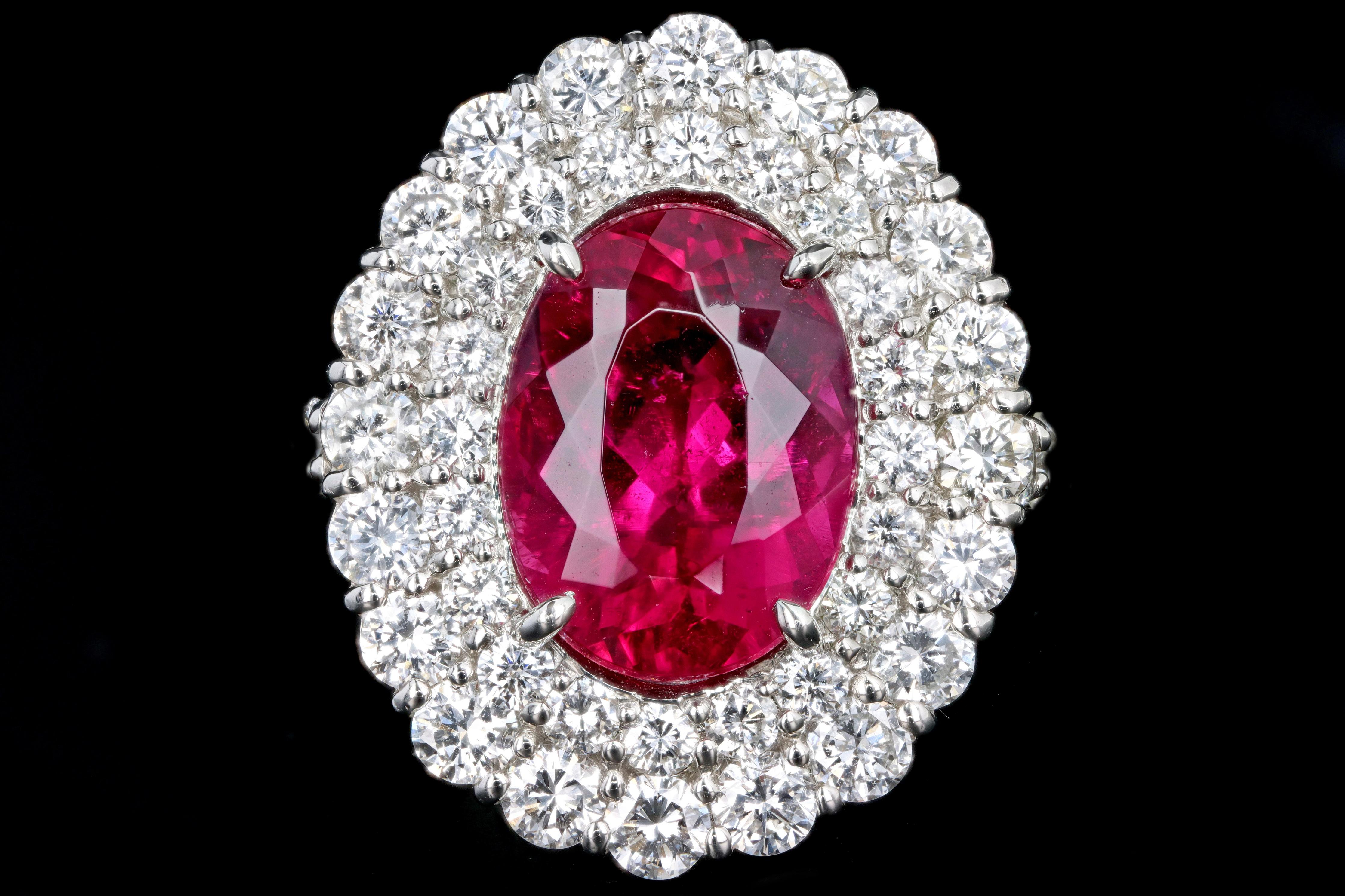 Era: Modern

Composition: Platinum 

Primary Stone: Oval Cut Rubellite Tourmaline

Carat Weight: Approximately 5.56 Carats

Accent Stone: Round Brilliant Diamonds 

Carat Weight: Approximately 2.79 Carats Total

Color/ Clarity: G/H - VS2/SI1

Ring