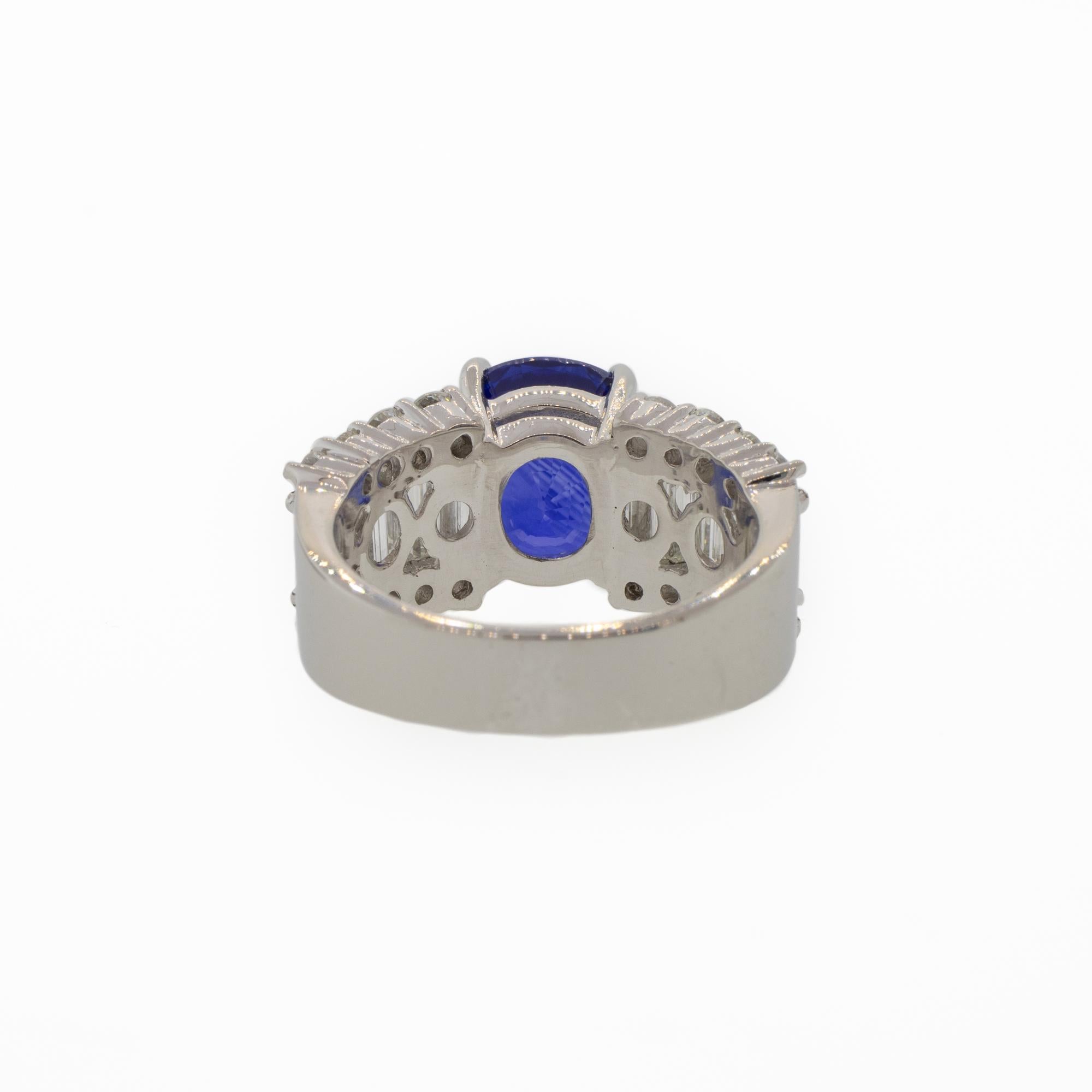 Cushion Cut Platinum 5.85 Carat Blue Sapphire and Baguette Diamond Ring For Sale