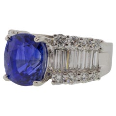 Retro Platinum 5.85 Carat Blue Sapphire and Baguette Diamond Ring