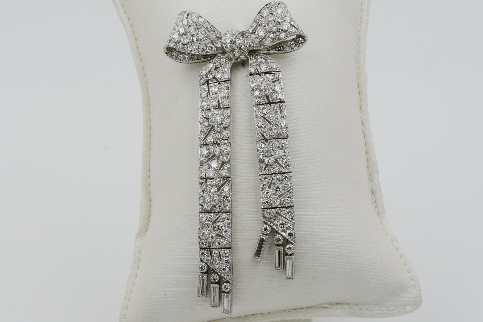 Exclusively from the Eiseman Estate Jewelry Collection, this Art Deco platinum bow pin made by CD Peacock features 215 traditional cut diamonds (6.00 ctw GH VS).