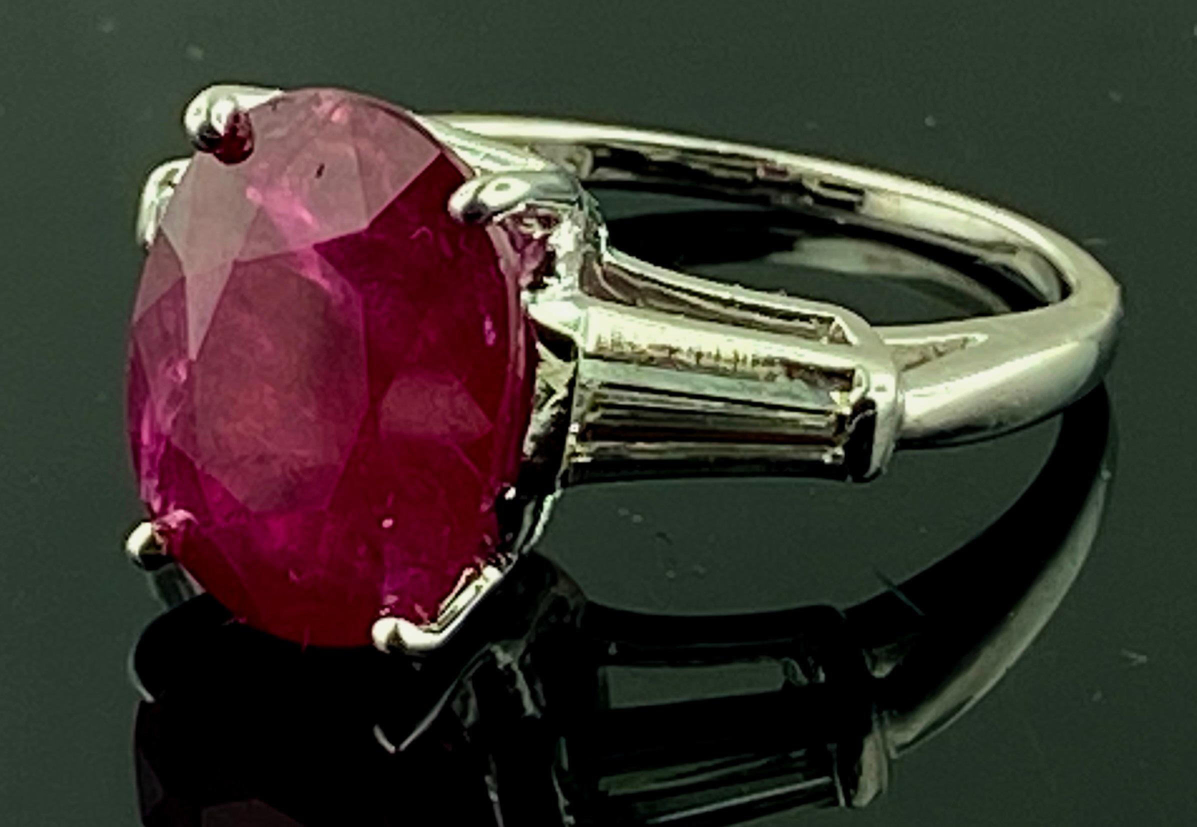 Set in Platinum is a 6.22 carat Ruby with 2 Tapered Baguettes on the sides with a diamond weight of 0.45 carats.  Ring Size is 6.