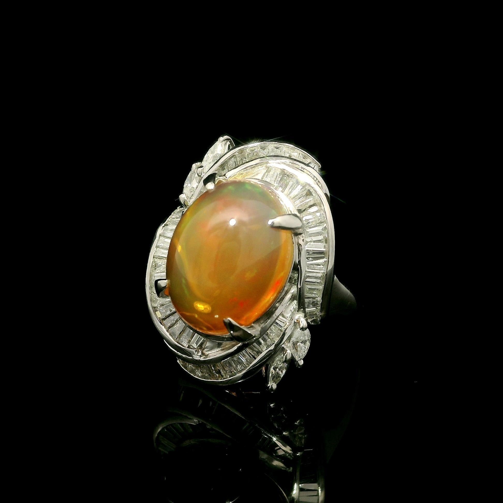 --Stone(s):--
(1) Natural Genuine Jelly Opal - Oval Cabochon Cut - Prong Set - Orange Color w/ Great Play of Colors - 13.7x10.7mm / 5.97ct (exact)
Numerous Natural Genuine Diamonds - Baguette & Marquise Cut - Prong & Channel Set - Nice Brilliant
