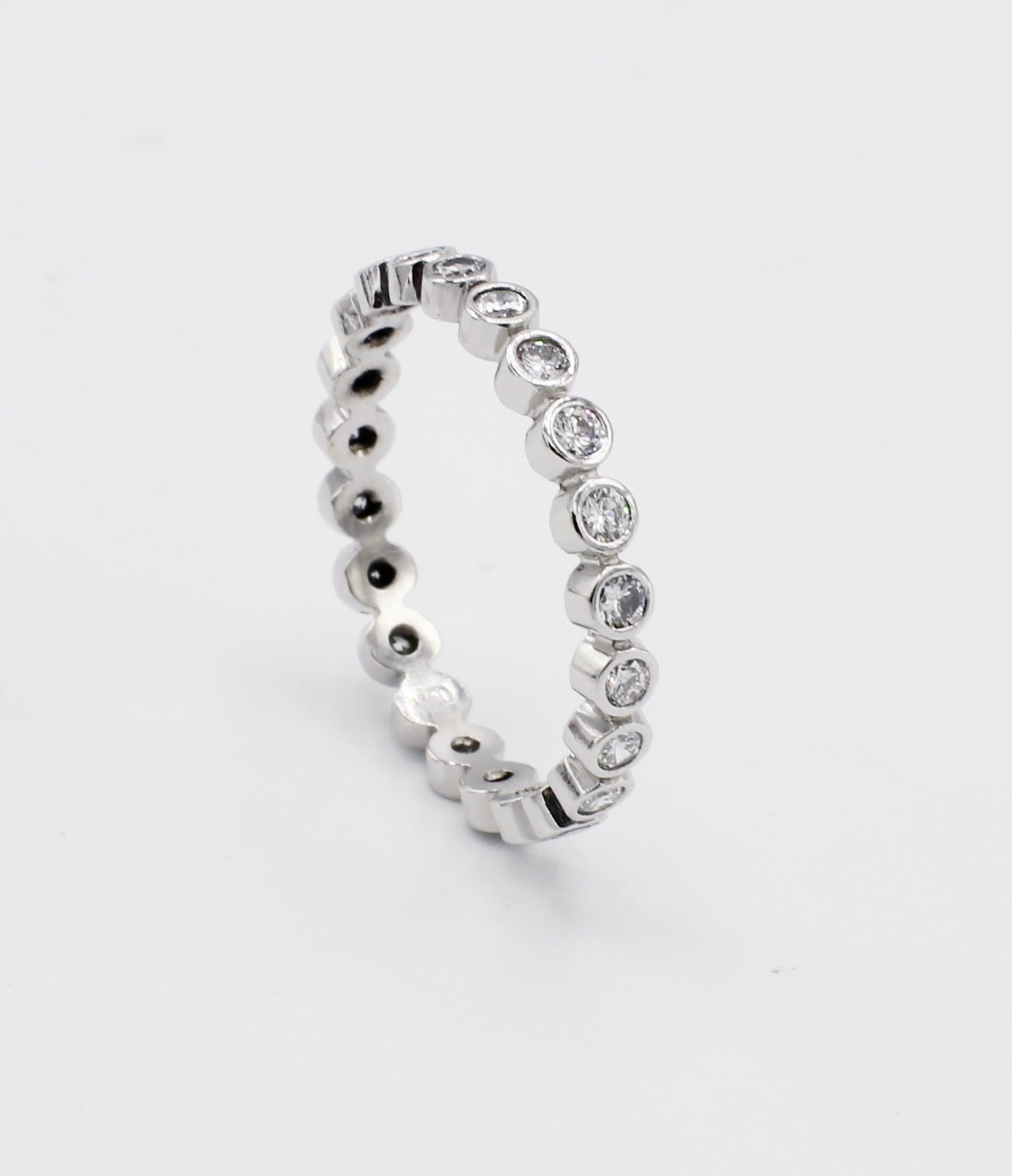 Platinum .70 Carat Bezel Set Diamond Eternity Band Ring Size 6.5
Metal: Platinum
Weight: 2.55 grams
Diamonds: Approx. .70 CTW G VS
Width: 2.5mm
Size: 6.5 (US)
