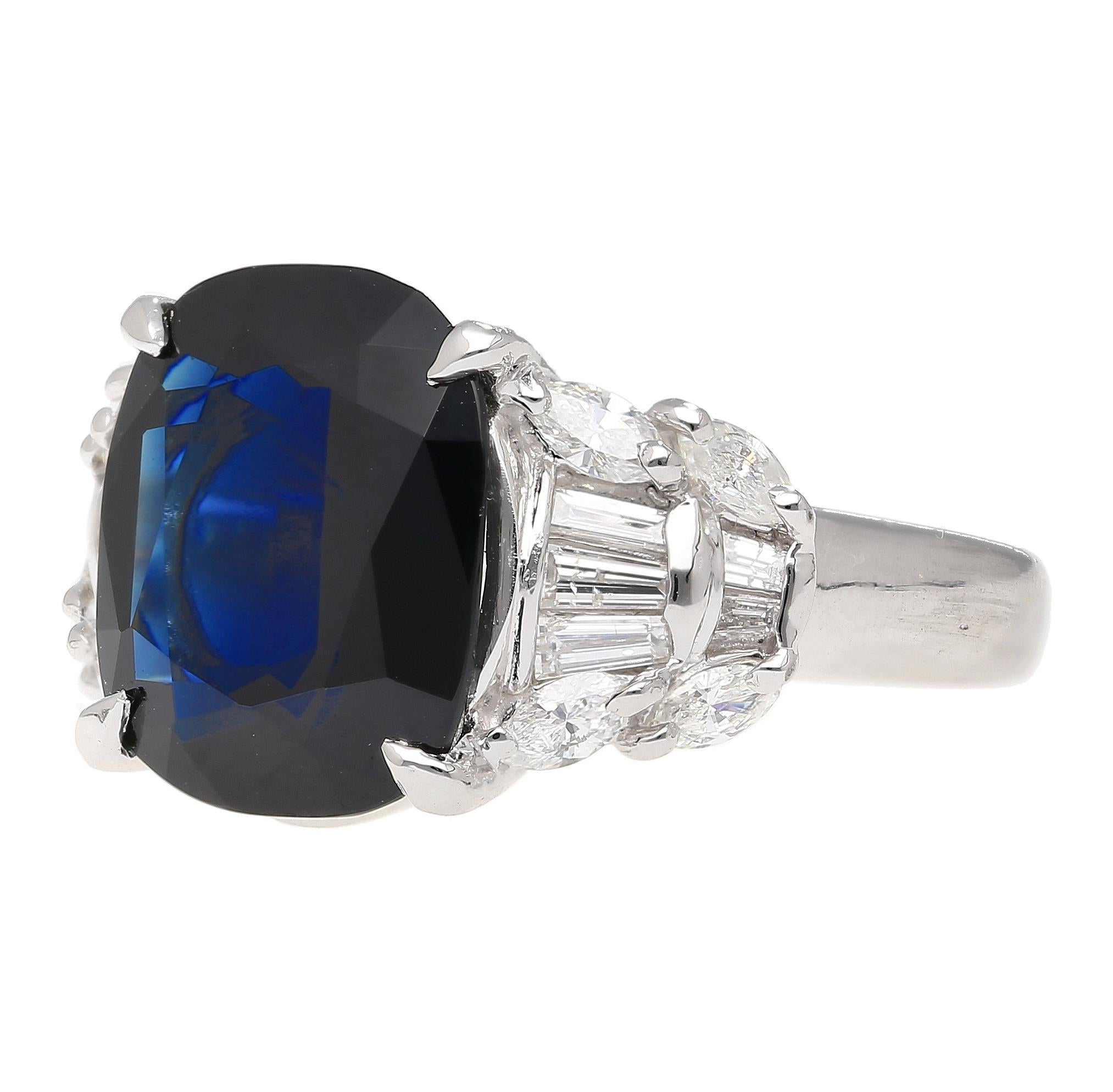 Details: 
- Item Type: Engagement Ring
- Metal: Platinum 900
- Size: 7 3/4 (adjustable)
- Weight: 10.21 grams  

Stone Details: 
- Gemstone: Blue Sapphire
- Carat: 7.52 
- Color: Blue
- Cut: Cushion 

Side Stone Details:
- 10 tapered baguette cut