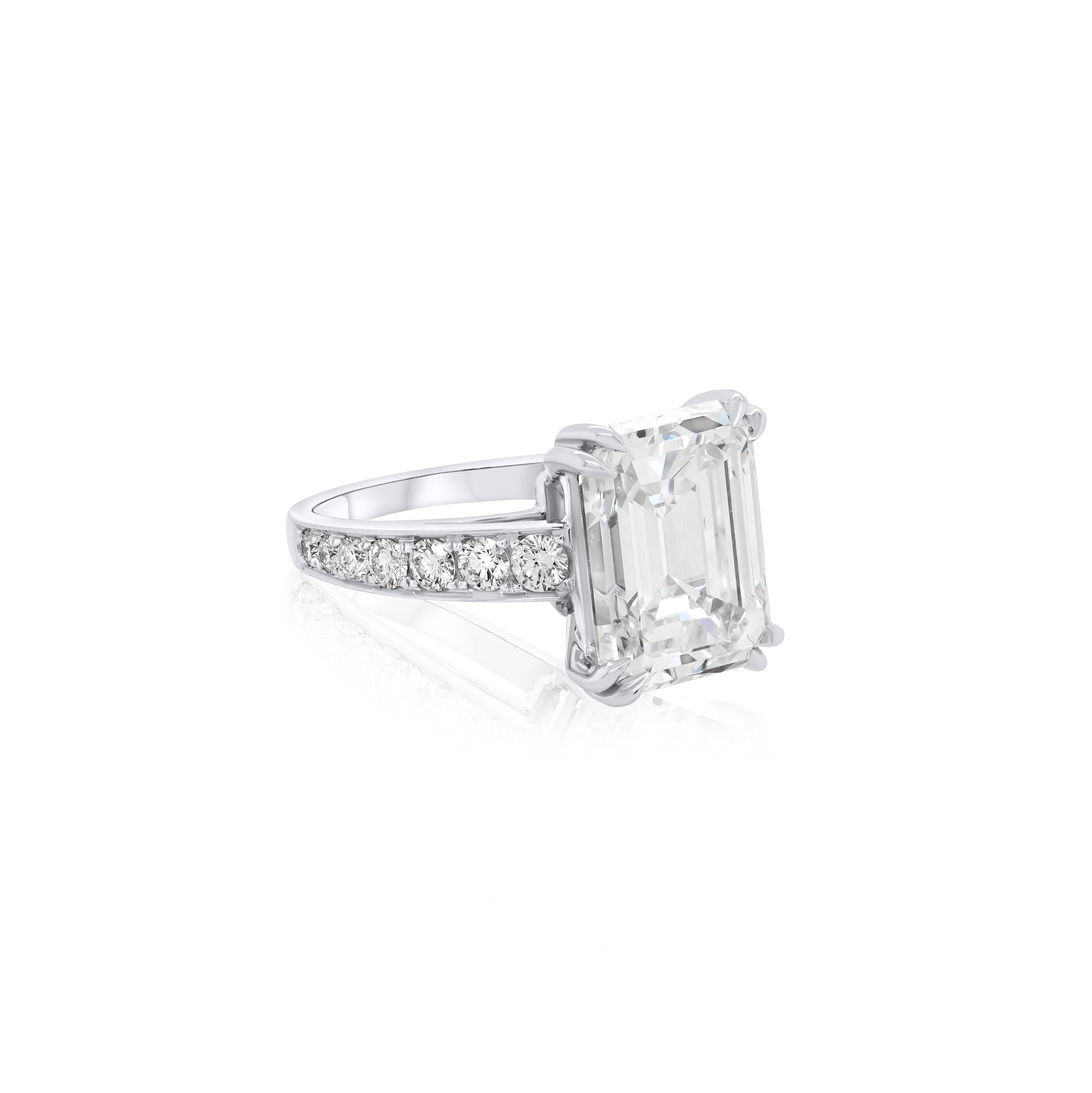 Platinum diamond ring features 7.59CTS G VS1 GIA#2215687521 emerald cut diamond set with 1.60 carats of diamonds. 
