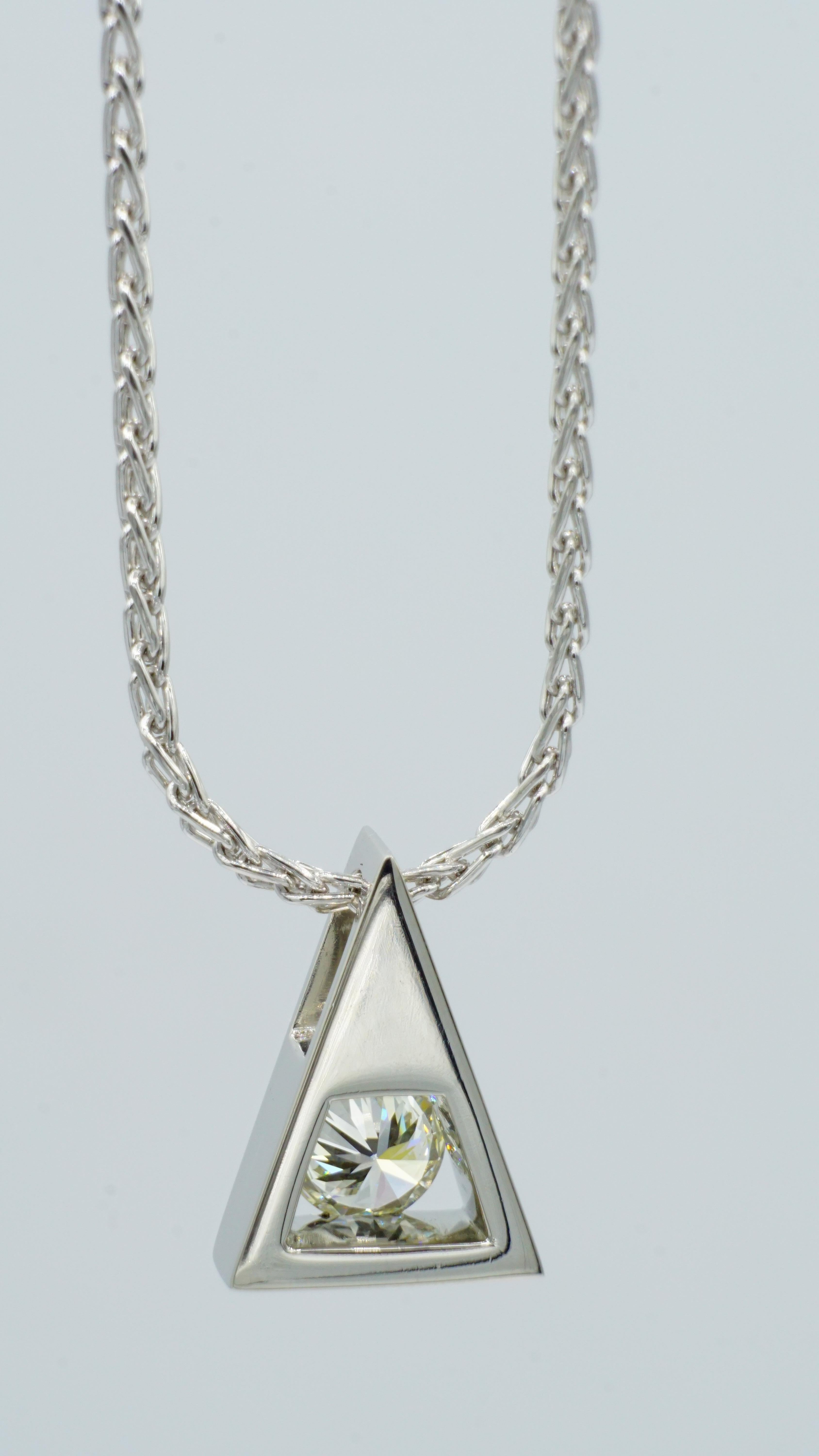 Platinum .75ct Round Brilliant Diamond Triangle Pendant by Rock N Gold Creations. Like-new condtion. The beautiful round brilliant diamond is I color and VS2 clarity, set in a platinum triangle pendant designed and created by Rock N Gold Creations.