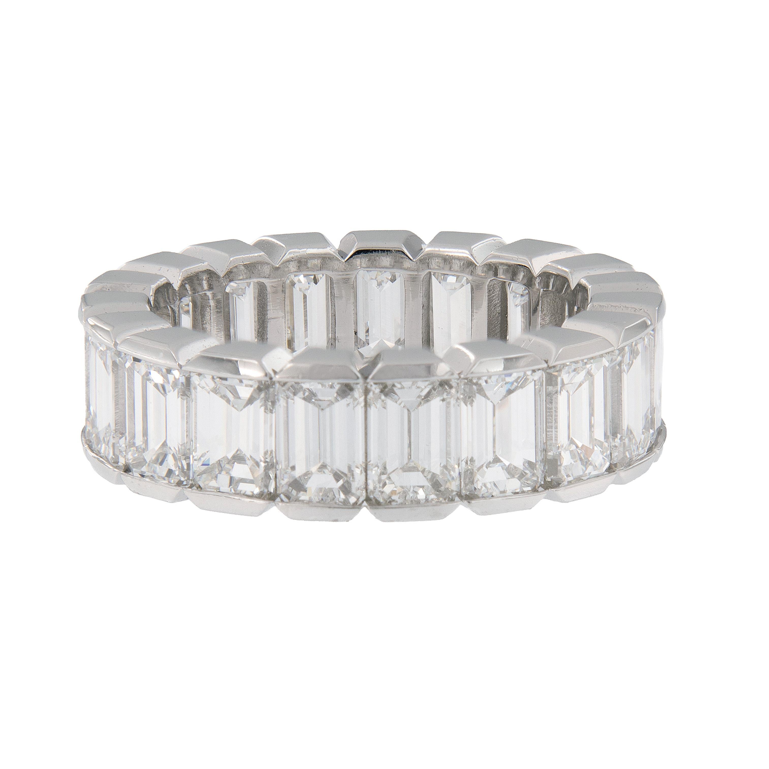Stunning eternity ring hand-fabricated in platinum features 19 emerald-cut, perfectly matching diamonds. Ring size 6.25. Weighs 9.3 grams.

Diamonds 8.02 Cttw VVS, D-F