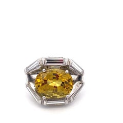Platinum 8.16 Carat Oval Yellow Sapphire and Baguette Diamond Ring
