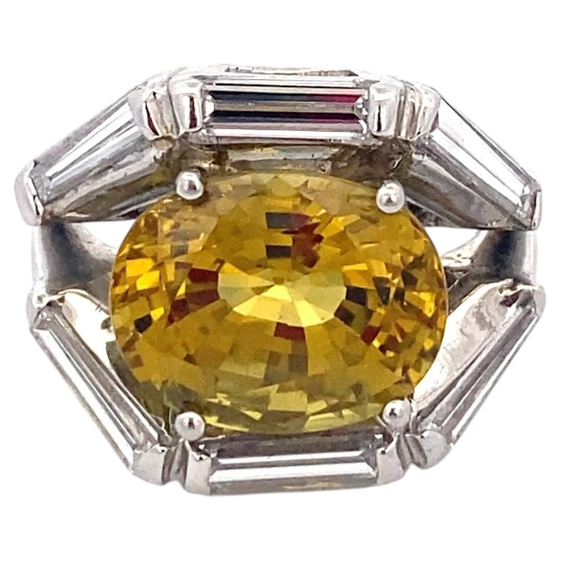 Platinum 8.16 Carat Oval Yellow Sapphire and Baguette Diamond Ring For Sale