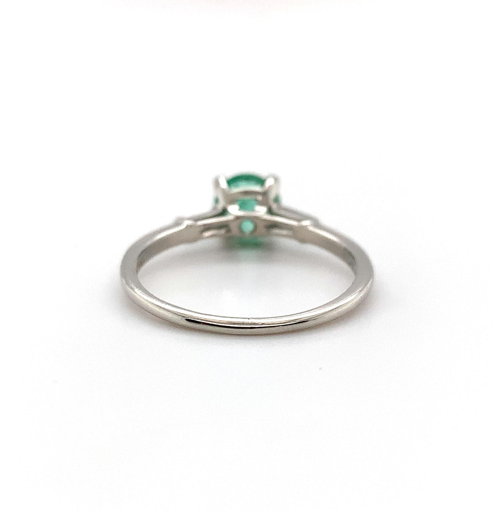 Modern Platinum .83ct Emerald and Diamond Baguette Ring