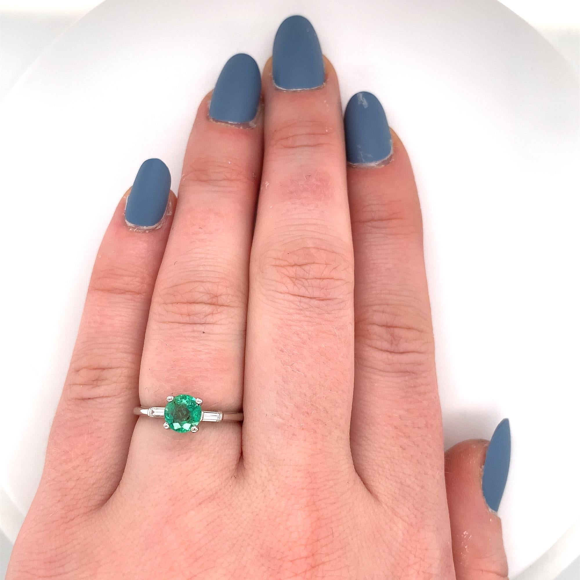 Women's Platinum .83ct Emerald and Diamond Baguette Ring
