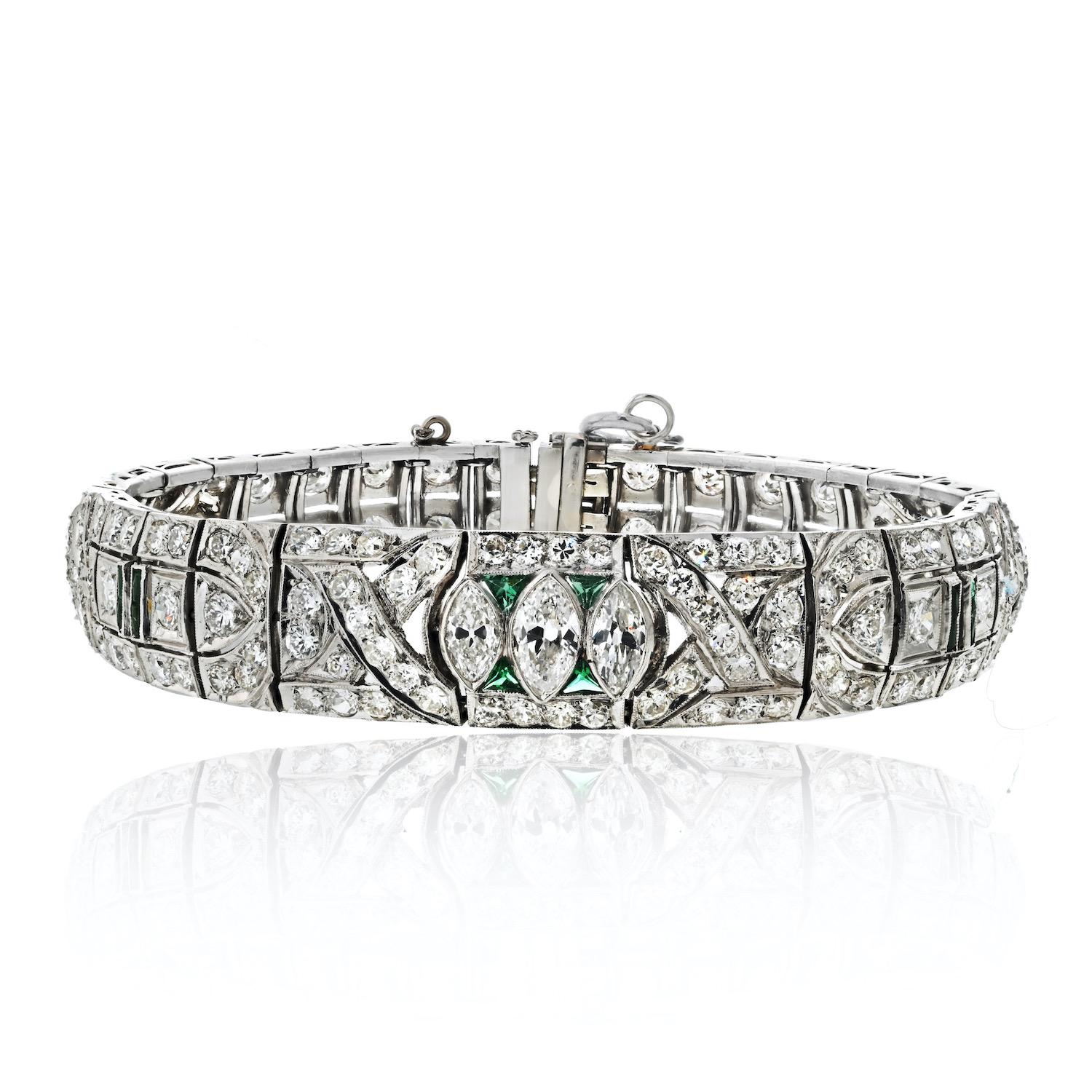 Immerse yourself in the timeless elegance of the Platinum Art Deco Diamond and Emerald Bracelet. 

This exquisite piece is a testament to the opulence and craftsmanship of the Art Deco era, showcasing a stunning combination of diamonds and