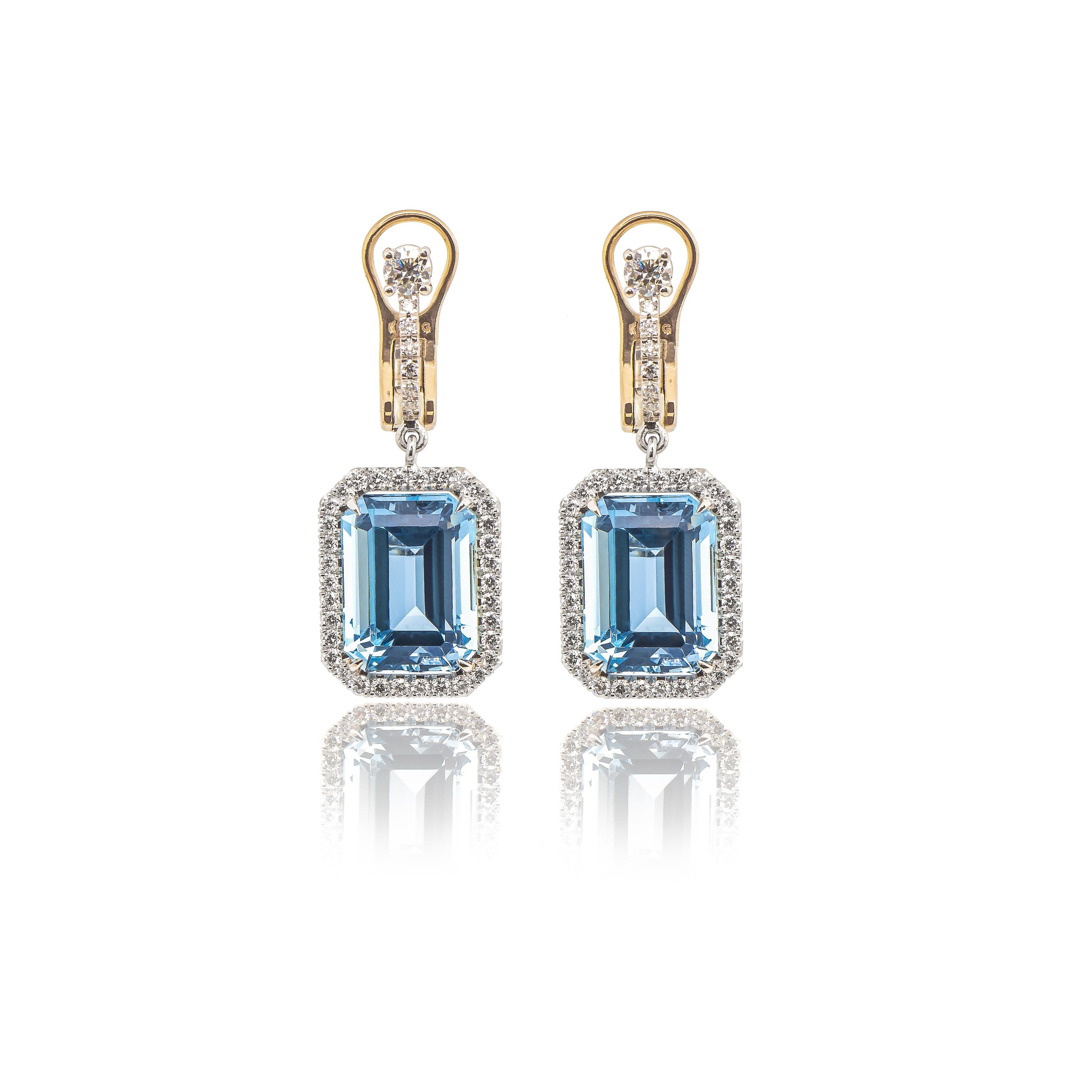 With a feminine design and a shimmering halo frame, these Eiseman Collection aquamarine drop earrings are set in platinum with 8.77 carats of emerald cut aquamarines (11.7 x 8.7mm) in a pave frame of 34 round brilliant 1.00 carat diamonds (G color