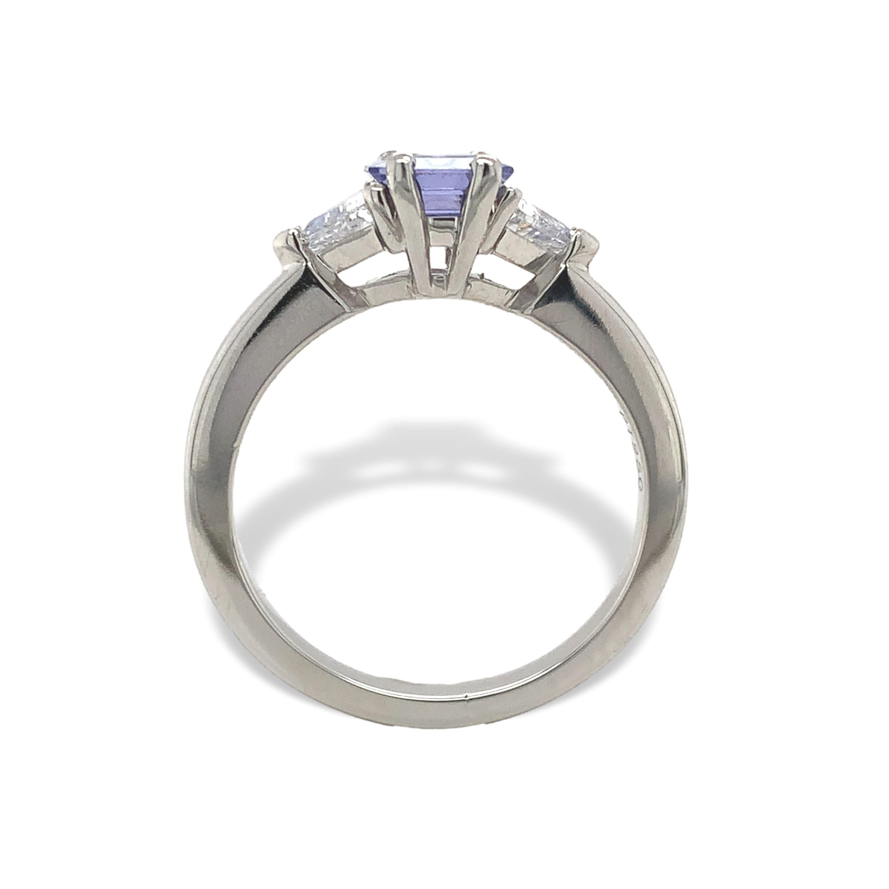 Platinum blue sapphire and diamond ring. The ring features a genuine earth mined asscher cut Ceylon sapphire. It measures about 5.8mm x 5.6mm and weighs .88cts. The sapphire has lighter periwinkle lavender-blue color. There are 2 natural earth mined
