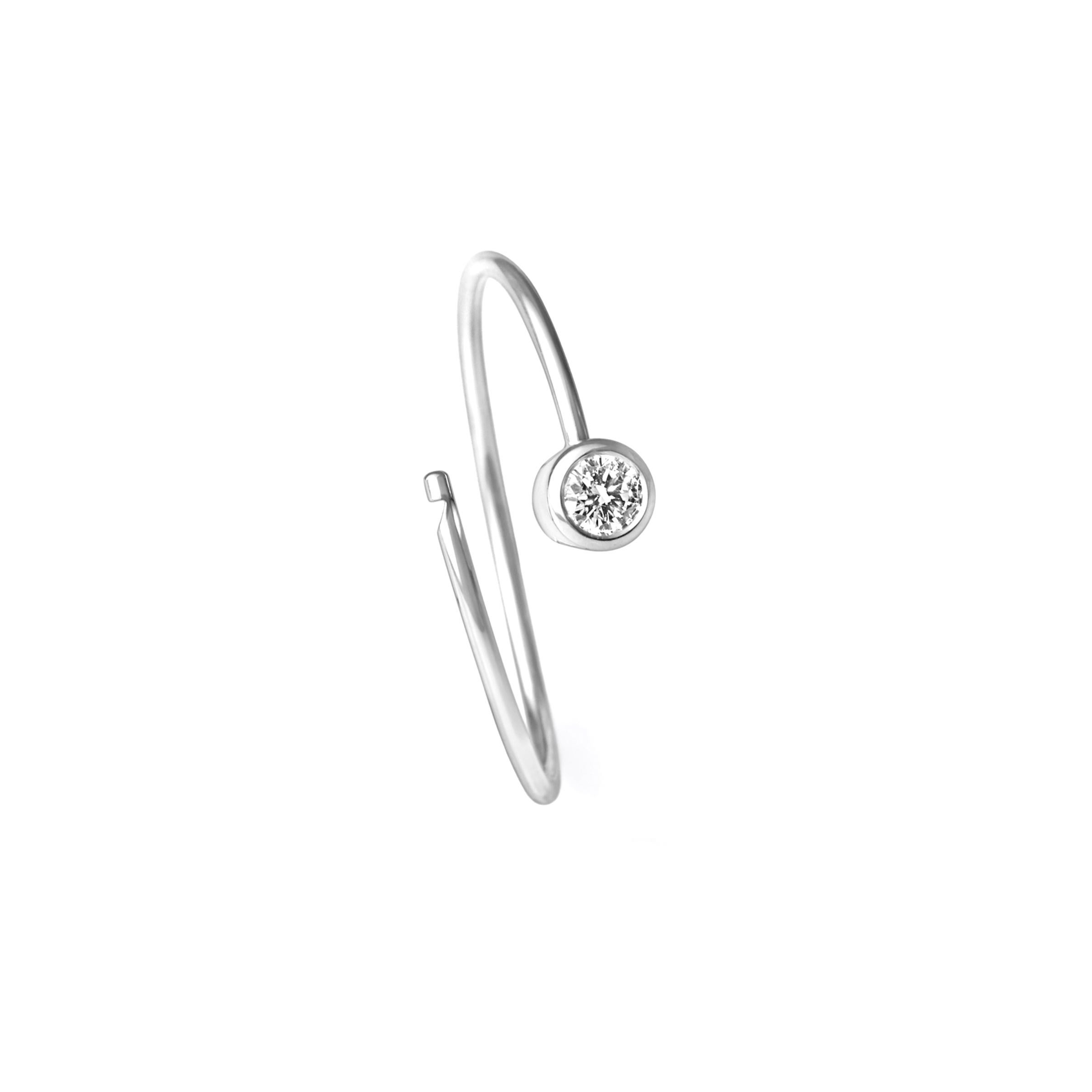 A single stone diamond hoop earring. The wire tension allows for a seamless circular post that hooks in place at the hidden clasp behind the stone. 

Diamond size 0.06ct
Setting diameter: 3.4mm
Hoop diameter 17mm
Wire width 0.9mm
Sold as a