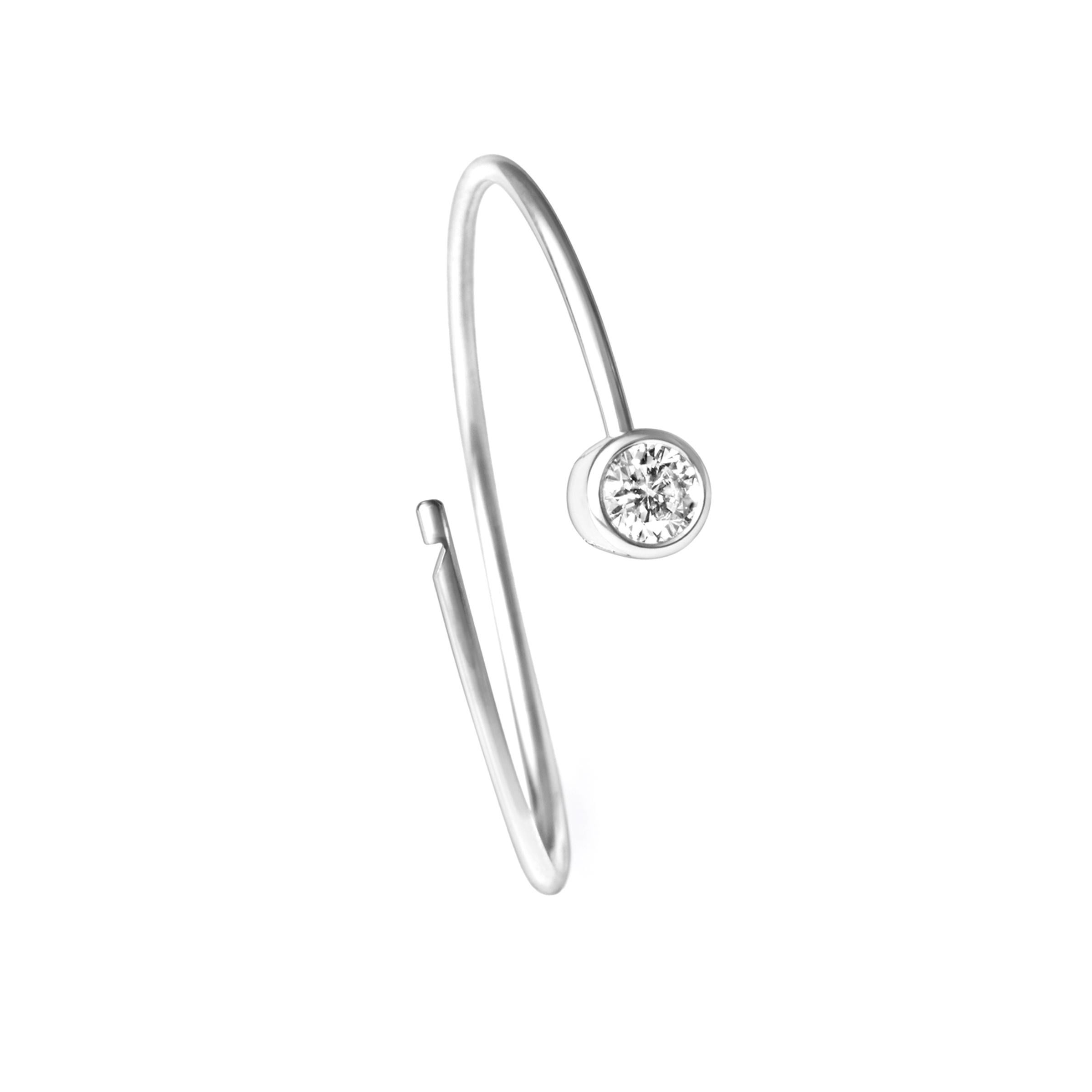 A single stone diamond hoop earring. The wire tension allows for a seamless circular post that hooks in place at the hidden clasp behind the stone.

Diamond size 0.1ct
Setting diameter: 4mm
Hoop diameter 22mm
Wire width 0.9mm
This item is sold as a