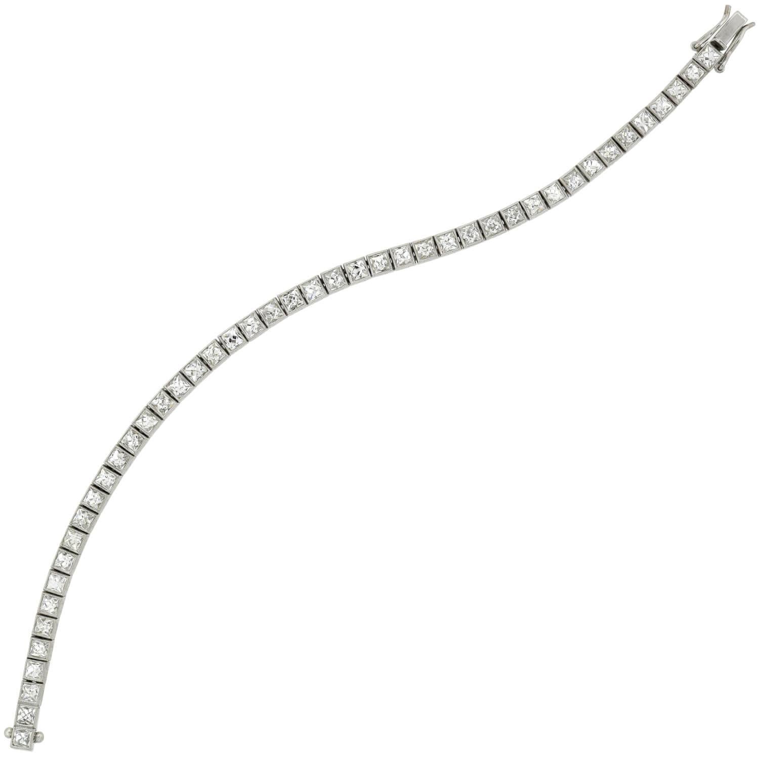 An absolutely stunning contemporary diamond line bracelet! Crafted in platinum, this gorgeous piece is comprised of 45 stunning French Cut diamond links. Each faceted diamond stone is held within a box setting to create a straight yet flexible