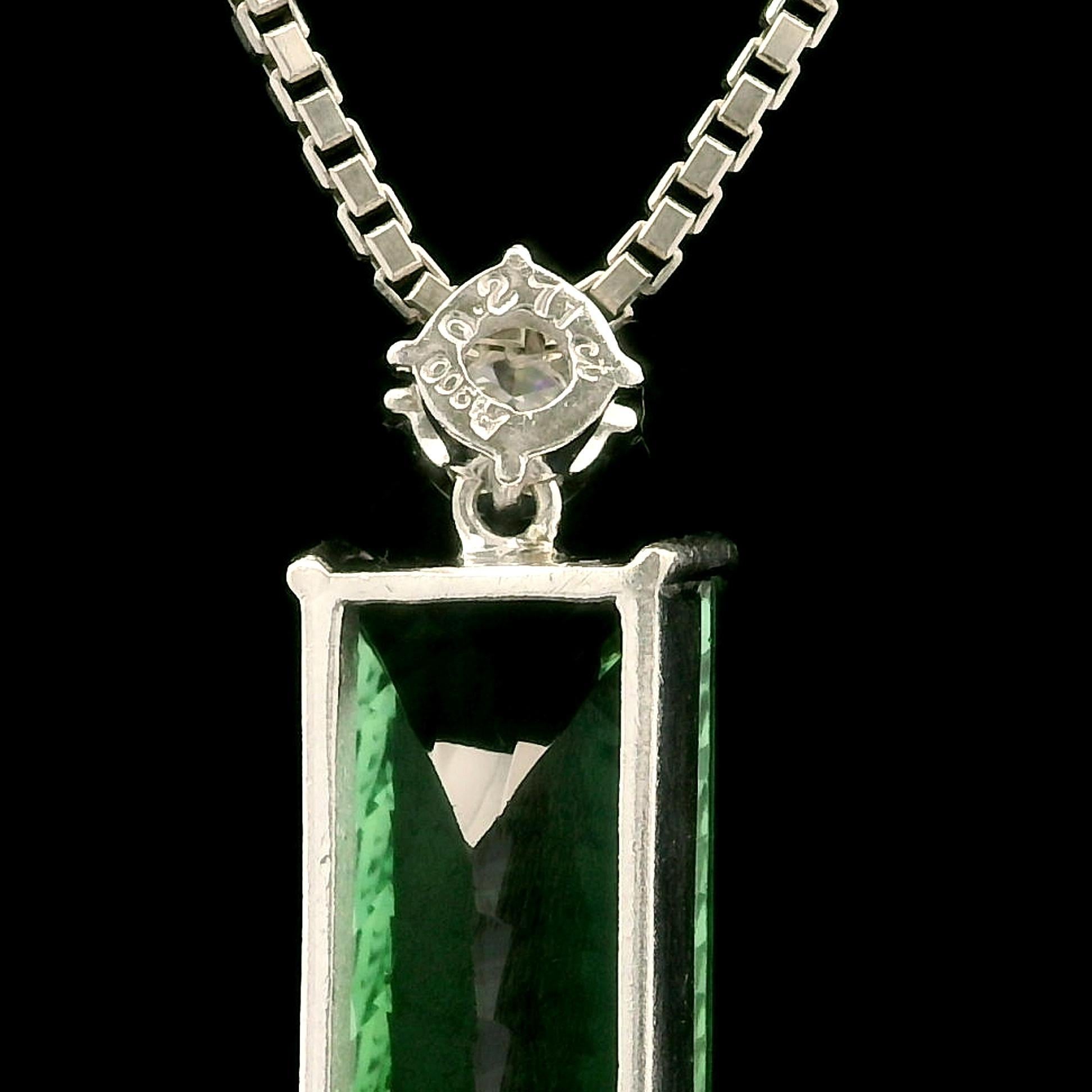 –Stone(s)–
(1) Natural Genuine Tourmaline - Long Rectangular Faceted Cut- Prong Set - Green Color - 20.2x8.2mm - 8.82ctw Exact
(1) Natural Genuine Diamond - Round Brilliant Cut - Prong Set - G Color -SI2 Clarity - 4.1mm - 0.27ct (exact)
Total