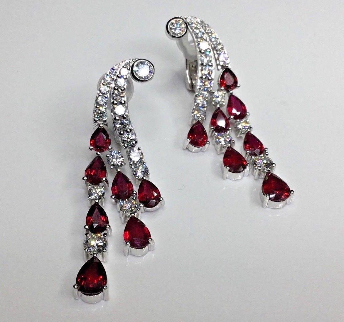 These are amazing quality  Estate Platinum 9.68 CTW Ruby & Diamond Chandelier Drop Dangle Earrings. The Ruby’s are absolutely gem quality pigeon blood red color and absolutely clean and transparent with no inclusions of any kind. The diamonds are to