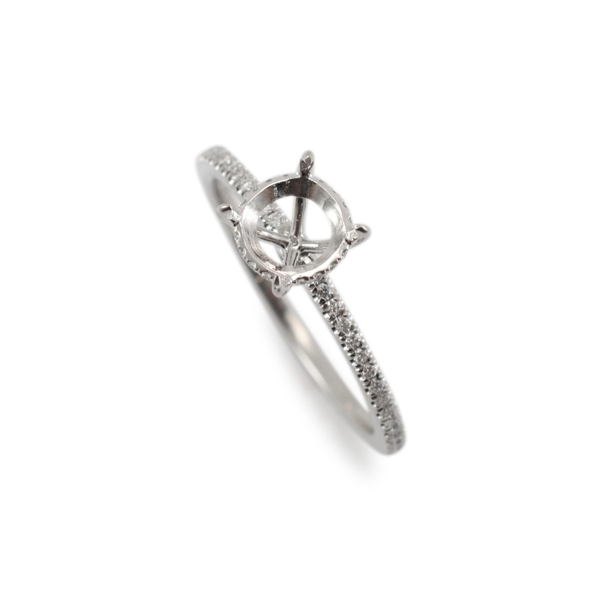 Gender: Ladies

Metal Type: 18K Yellow Gold

Size: 6.5

Shank Width: 1.40 mm

Weight: 2.86 Grams

One ladies 950 platinum diamond accented semi-mount engagement hidden halo ring with a half round shank. The metal was tested and determined to be 950