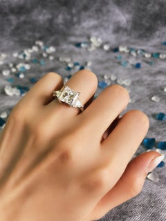 Platinum AGI Certified Three-Stone Engagement Ring Features 4.51ct Tcw Diamonds
