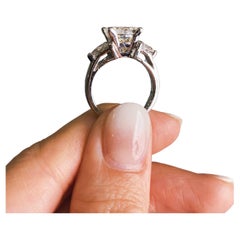 Platinum AGI Certified Three-Stone Engagement Ring Features 4.51ct TCW Diamonds