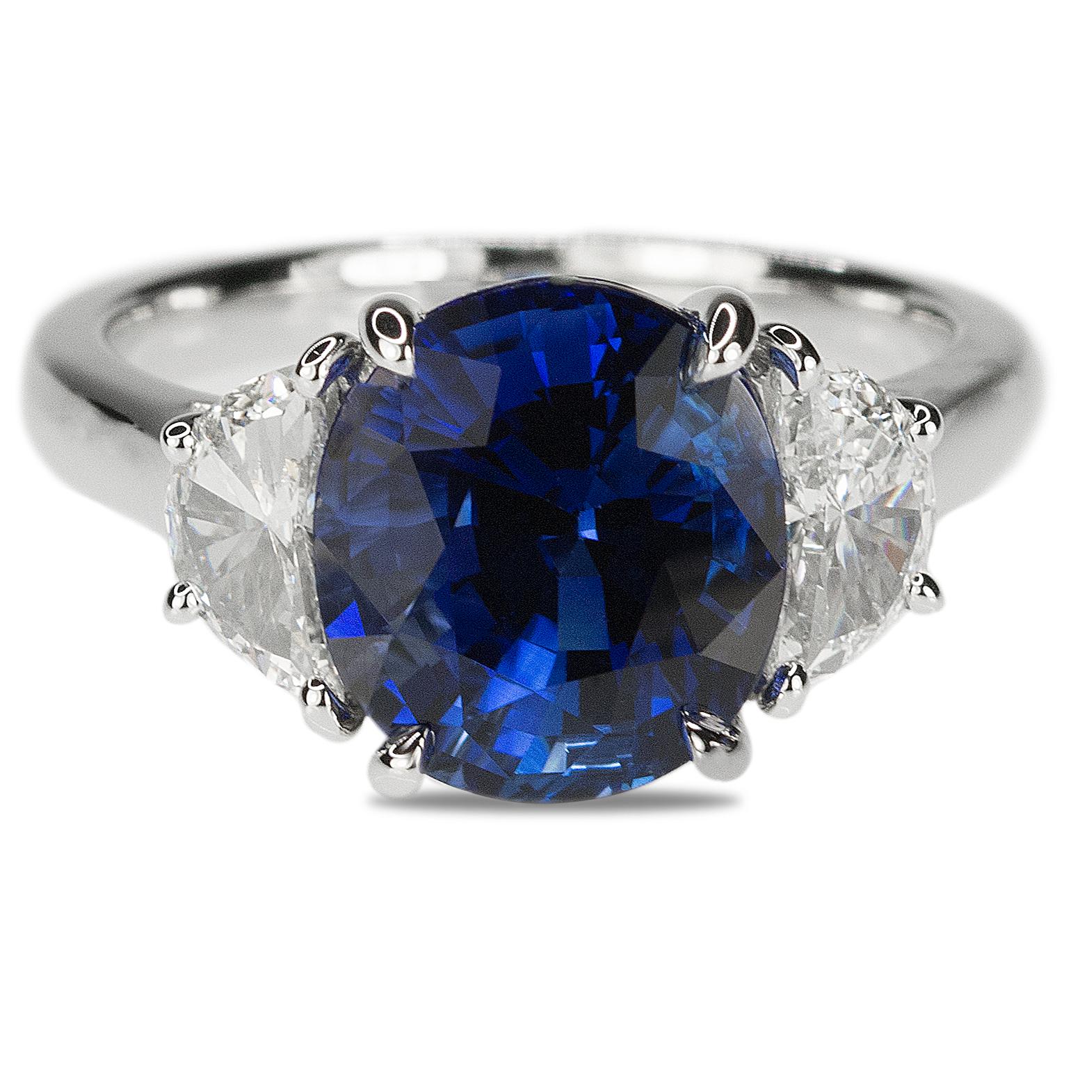 Platinum Ring with one AGL certified 5.18 carat Ceylon Sapphire an two half moons weighing 0.80 carats. 8.19g