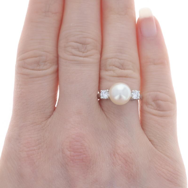 Size: 4 3/4
Sizing Fee: Up 2 sizes for $80 or Down 1 size for $60

Metal Content: Platinum

Stone Information
Akoya Pearl
Color: White
Size: 9.2mm

Natural Diamonds
Carat(s): .34ctw
Cut: Round Brilliant
Color: F - G
Clarity: VS1 - VS2

Total Carats: