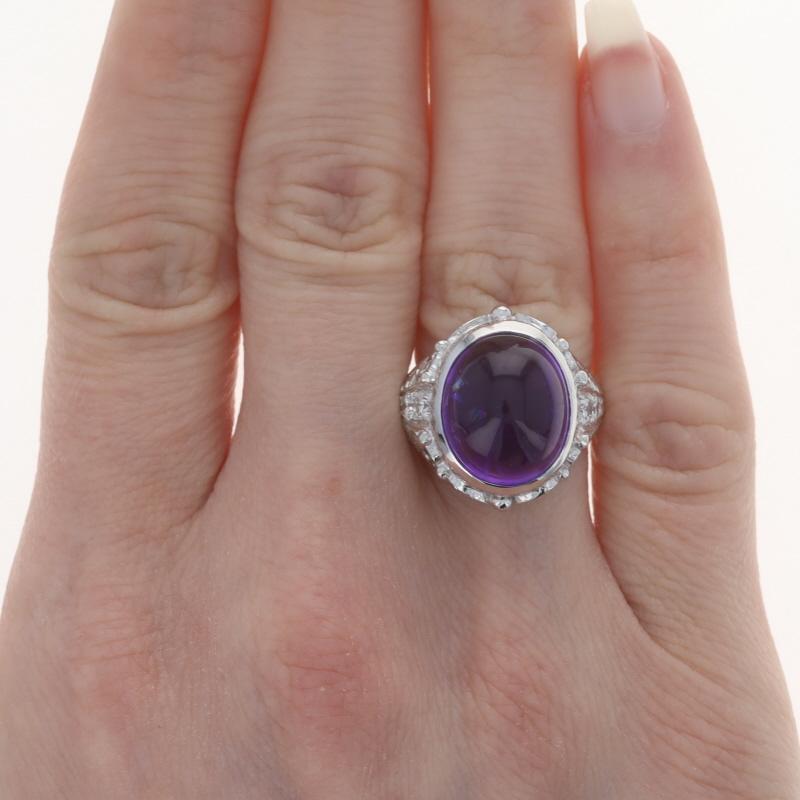 Dimensione: 7

Contenuto metallico: Platino

Informazioni su A. Stone
Ametista naturale
Carati: 9,50ct
Taglio: Cabochon ovale
Colore: viola

Diamanti naturali
Carati: .42ctw
Taglio: Rotondo brillante
Colore: G - H
Chiarezza: VS1 - VS2

Carati