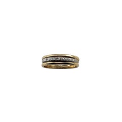Platinum and 14 Karat Yellow Gold and Diamond Band Ring