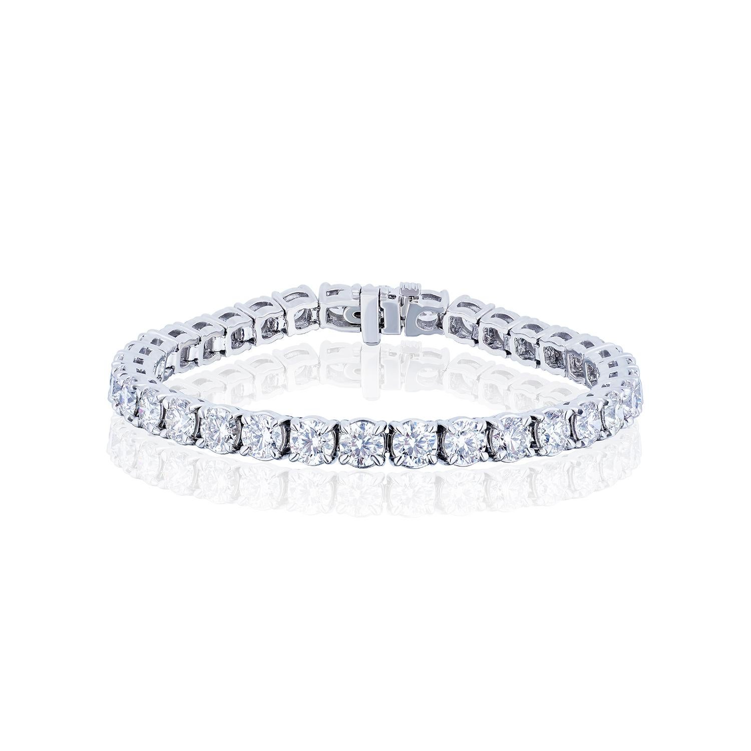 The Perfect Tennis Bracelet.

34 perfectly matched Round Brilliant Diamonds totaling 14.13 Carats in a straight line Bracelet.
Diamonds are H-I color and VS Clarity.
Set in Platinum.
7 inches.