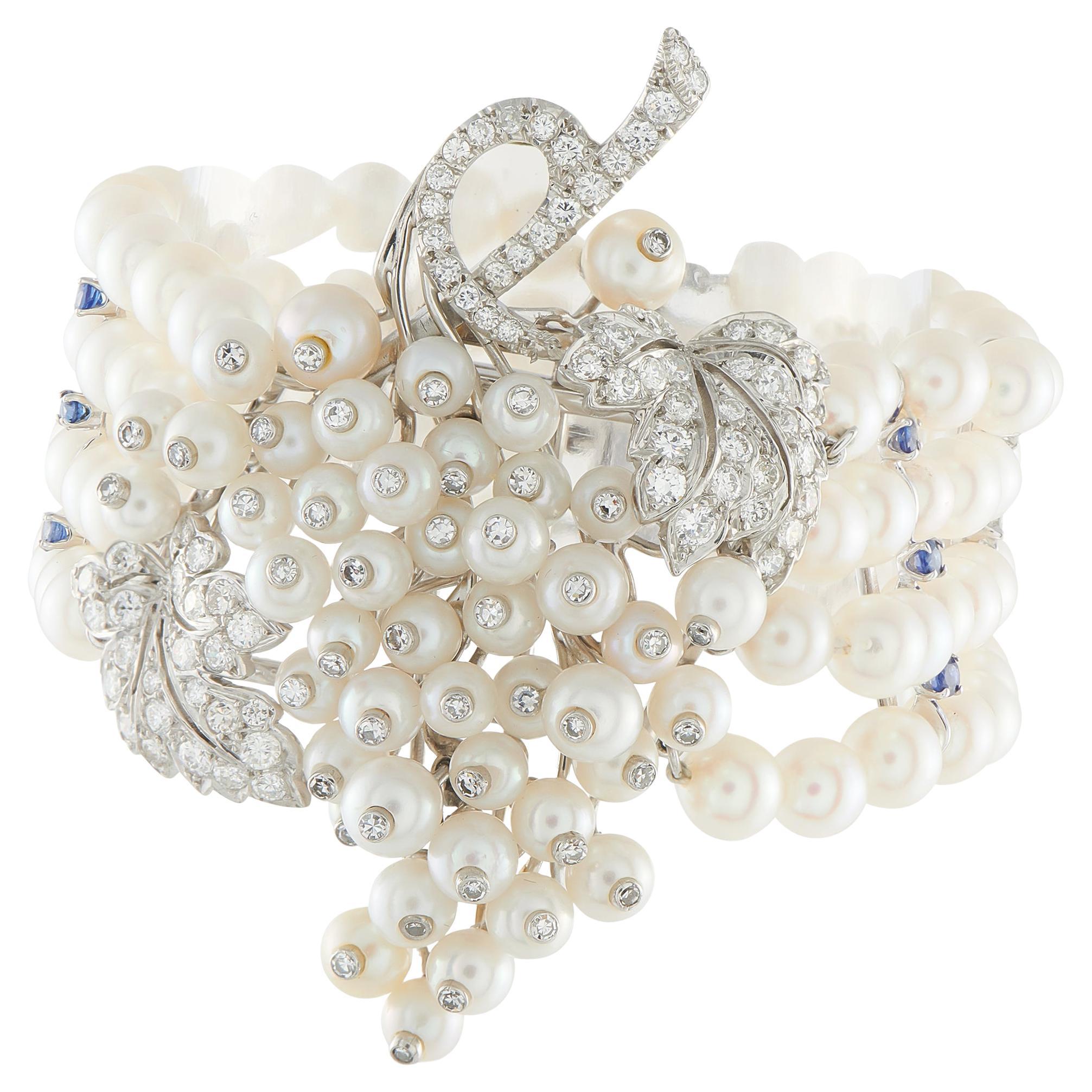 Bracelet en platine et or blanc 14 carats 3,20 ct de diamants, saphirs et perles