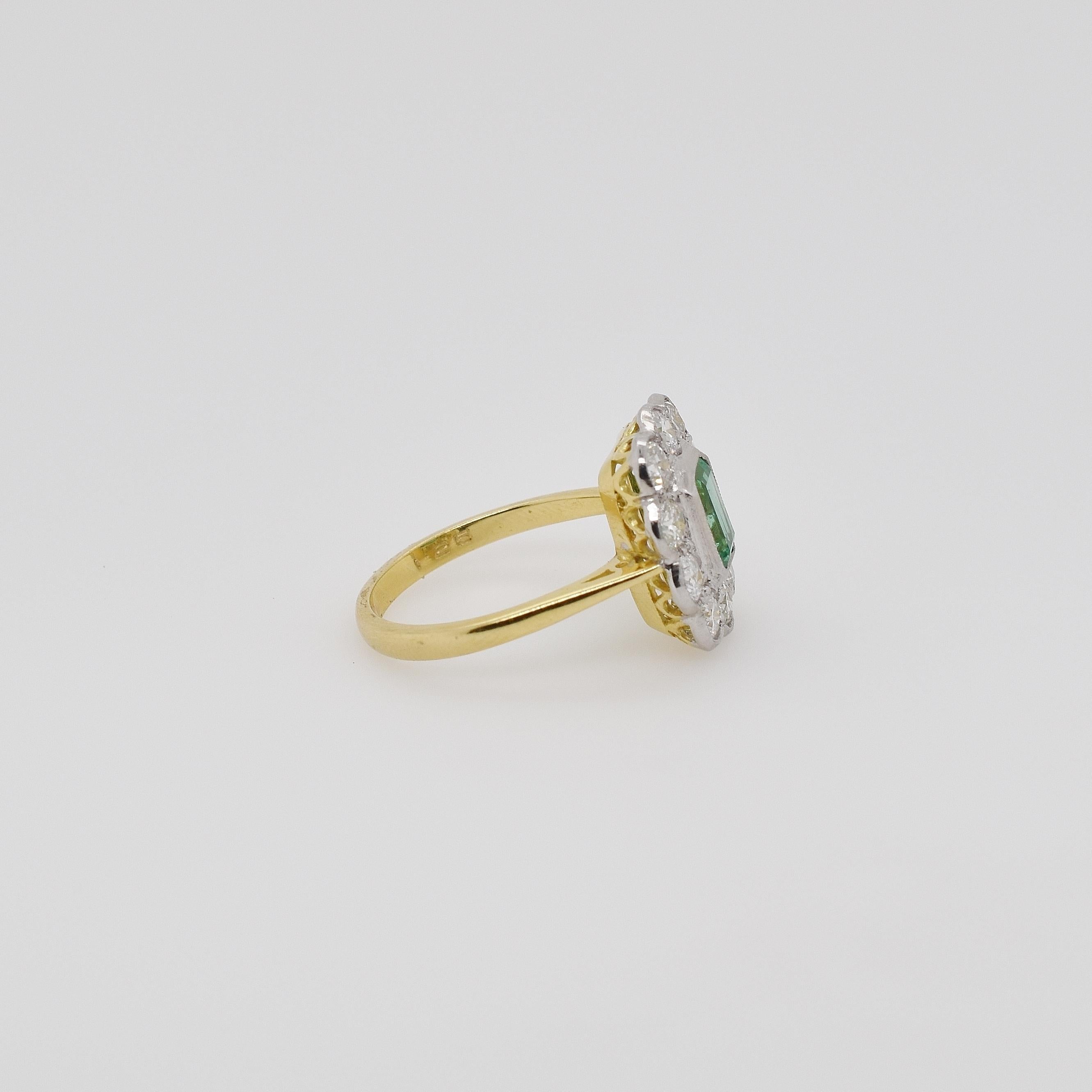 18ct yellow gold and platinum vintage emerald and old cut diamond cluster ring. The center emerald cut emerald is 0.85ct, surrounded by 10 old cut diamonds totalling 1.00ct. 
Size 7 US - can be resized