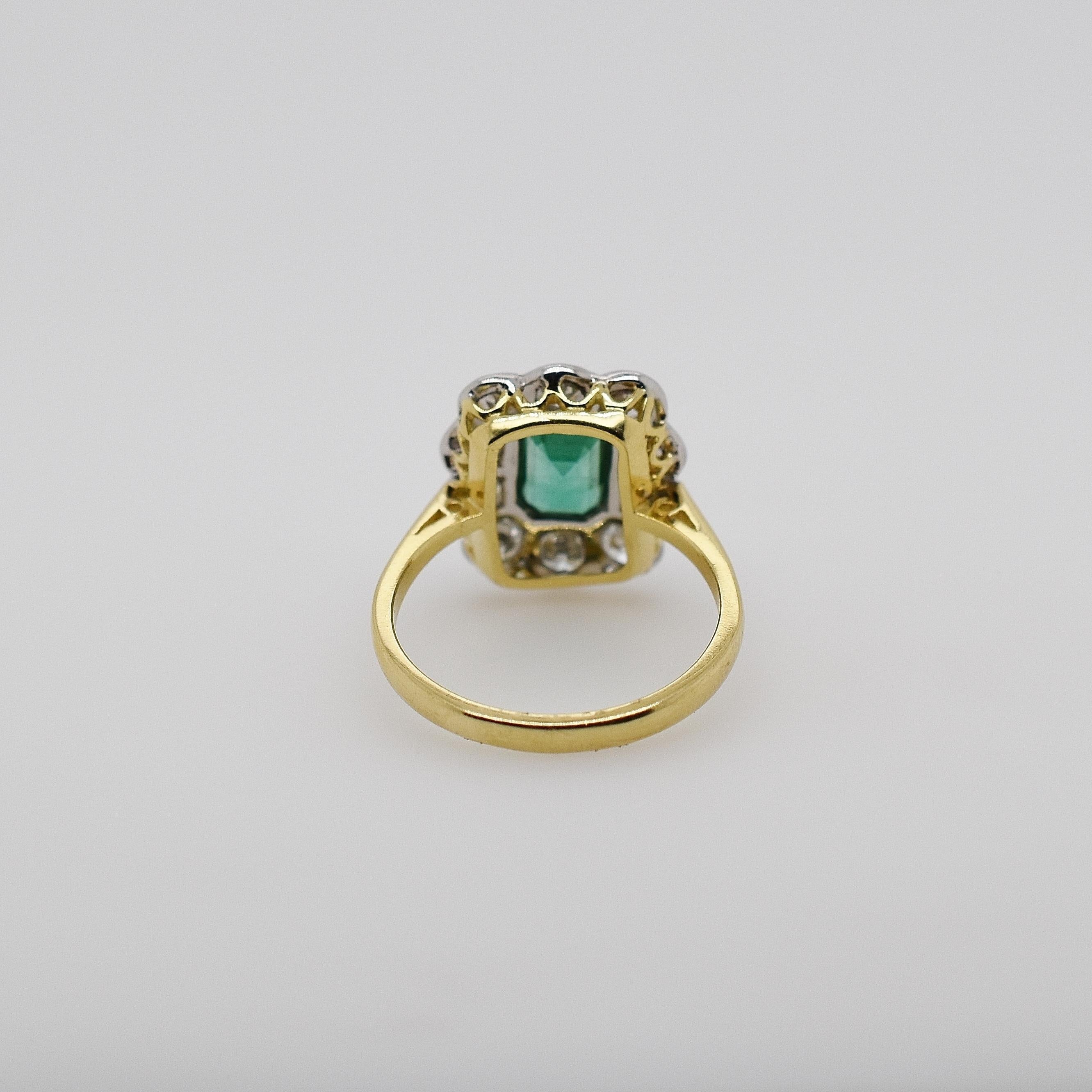 Edwardian Platinum and 18 Carat Gold Emerald and Old Cut Diamond Scalloped Cluster Ring