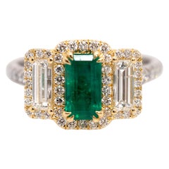Platinum and 18 Karat Gold 1.06ct Emerald Ring with Baguettes and Round Diamonds