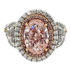 Platinum and 18 Karat Gold 2.55 Carat Oval Fancy Intense Pink HPHT Diamond Ring