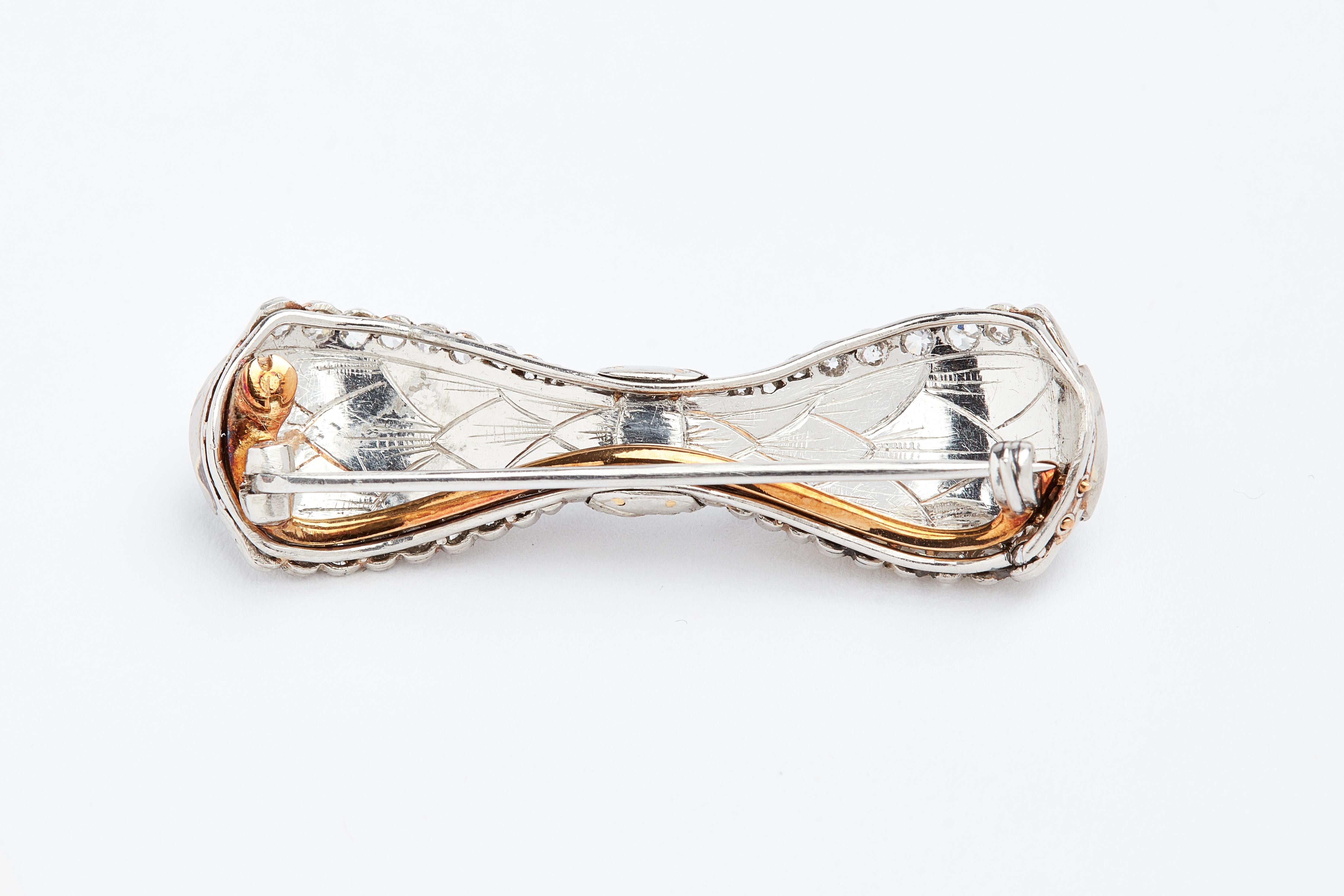 Platinum and 18k yellow gold Carved Crystal and DIamond Antique Bow brooch