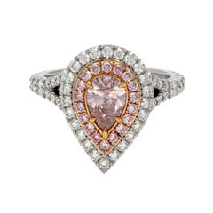 Platinum and 18 Karat Rose Gold Double Halo Diamond and Fancy Pink Diamond Ring