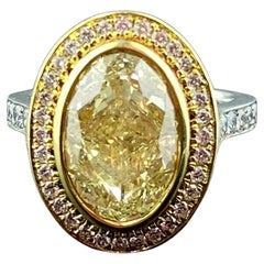 GIA 5.02 carat Platinum and 18 Karat Yellow Gold Fancy Light Yellow Diamond Ring