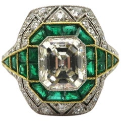 Platinum and 18 Karat Yellow Gold Art Deco Style Diamond and Emerald Ring